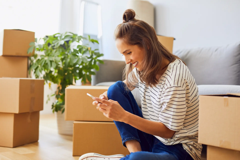 woman booking moving company on phone
