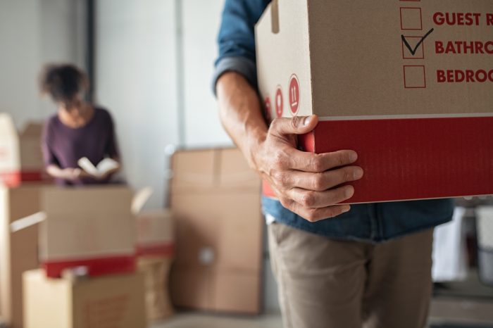man holding moving box