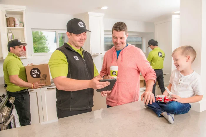 You Move Me mover reviewing costs with home owner